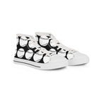 Black and white shoes standing under a kak lamp.