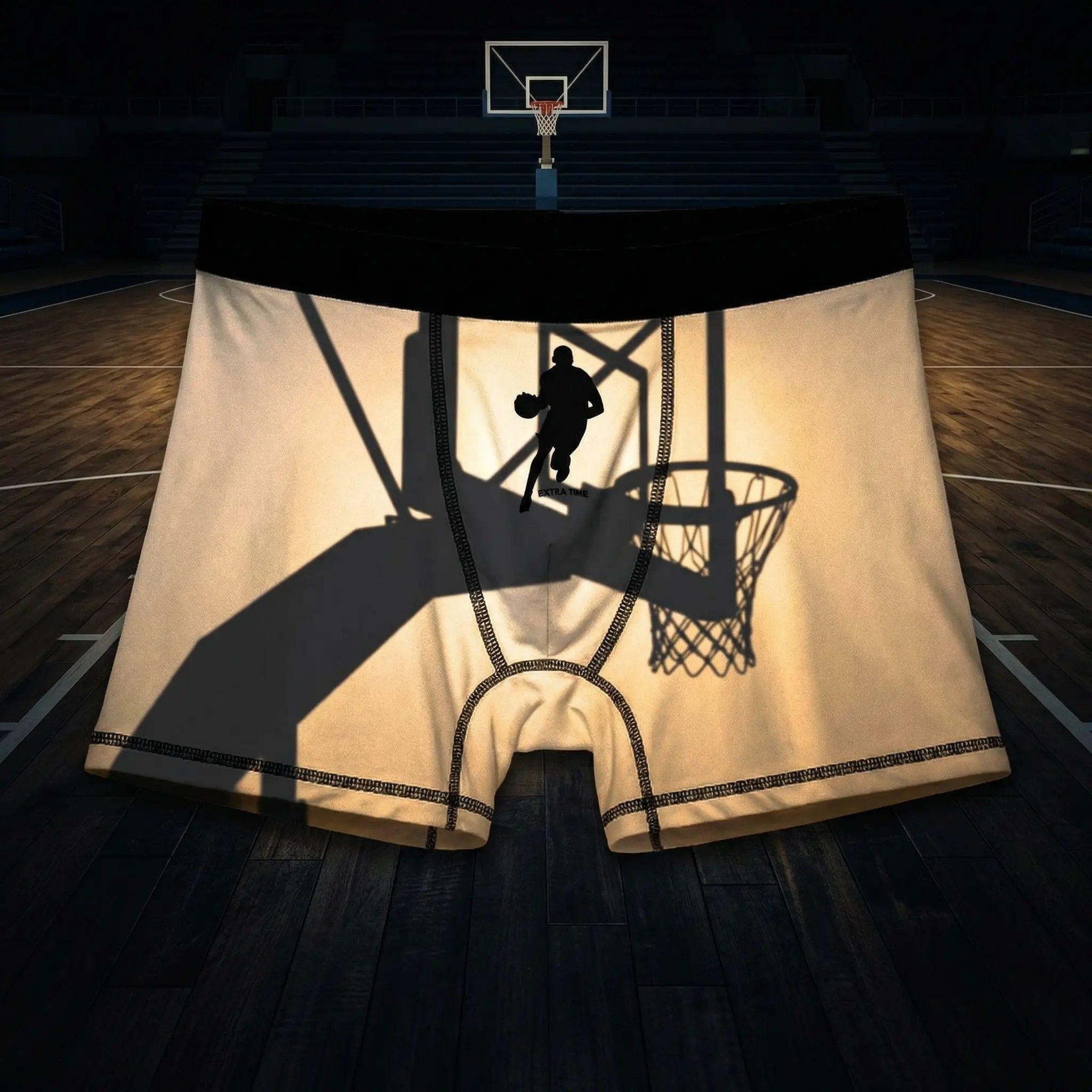 Creative product photography, the boxer displayed centrally, a silhouette shadow of a basketball hoop projected onto